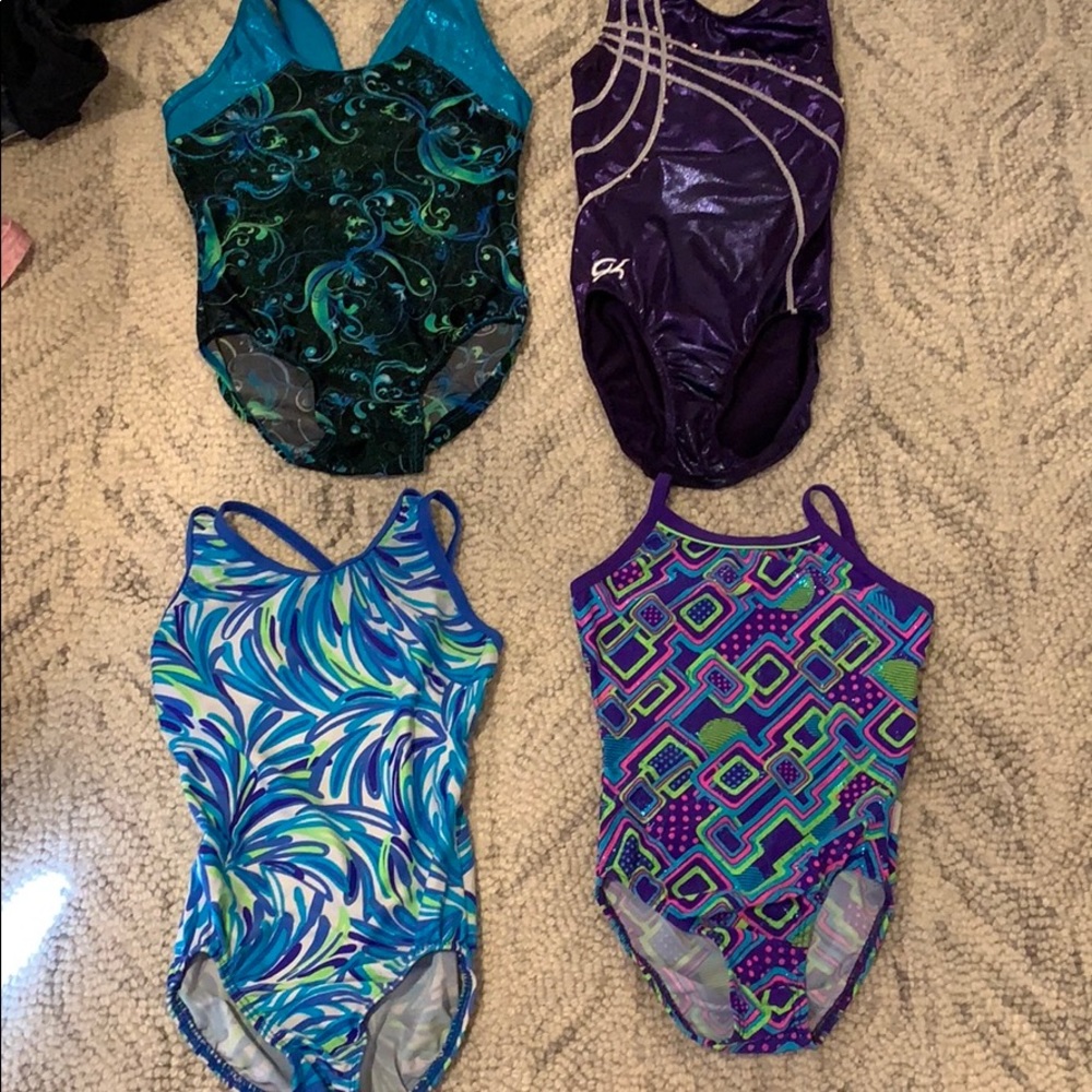 Four gymnastics leotards